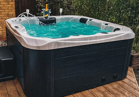 A close-up view of a hot tub with bubbling water.